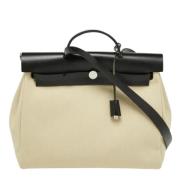 Pre-owned Canvas handbags Hermès Vintage , Beige , Dames