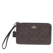 Pre-owned Coated canvas clutches Coach Pre-owned , Brown , Dames
