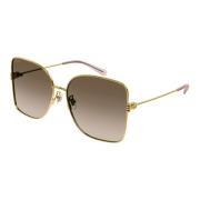 Goud/bruin getinte zonnebril Gucci , Yellow , Dames