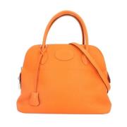 Pre-owned Leather shoulder-bags Hermès Vintage , Orange , Dames