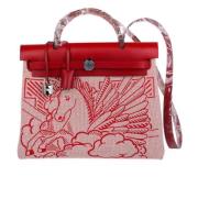 Pre-owned Canvas handbags Hermès Vintage , Red , Dames