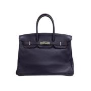 Pre-owned Leather handbags Hermès Vintage , Purple , Dames