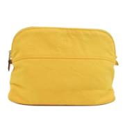 Pre-owned Leather pouches Hermès Vintage , Yellow , Dames