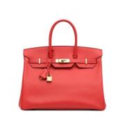 Pre-owned Leather handbags Hermès Vintage , Red , Dames