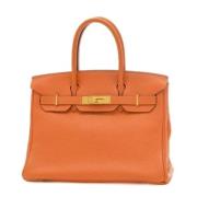 Pre-owned Leather handbags Hermès Vintage , Orange , Dames