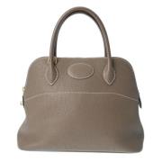 Pre-owned Leather handbags Hermès Vintage , Beige , Dames