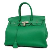 Pre-owned Fabric handbags Hermès Vintage , Green , Dames