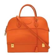 Pre-owned Fabric handbags Hermès Vintage , Orange , Dames