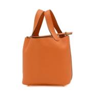 Pre-owned Leather handbags Hermès Vintage , Orange , Dames