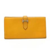 Pre-owned Leather wallets Hermès Vintage , Yellow , Dames