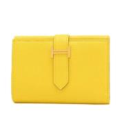 Pre-owned Canvas wallets Hermès Vintage , Yellow , Dames