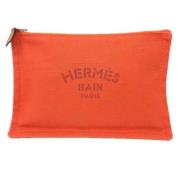 Pre-owned Canvas pouches Hermès Vintage , Orange , Dames