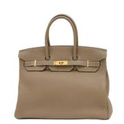 Pre-owned Leather handbags Hermès Vintage , Beige , Dames