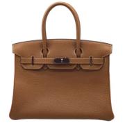 Pre-owned Leather handbags Hermès Vintage , Brown , Unisex