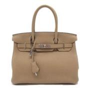 Pre-owned Leather handbags Hermès Vintage , Beige , Dames