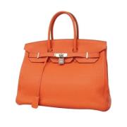 Pre-owned Leather handbags Hermès Vintage , Orange , Dames