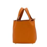 Pre-owned Leather handbags Hermès Vintage , Orange , Dames