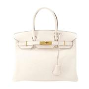 Pre-owned Leather handbags Hermès Vintage , Beige , Dames