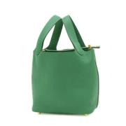 Pre-owned Leather handbags Hermès Vintage , Green , Dames