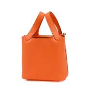 Pre-owned Leather handbags Hermès Vintage , Orange , Dames