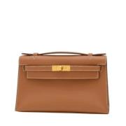 Pre-owned Leather clutches Hermès Vintage , Brown , Dames