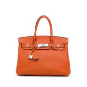 Pre-owned Leather handbags Hermès Vintage , Orange , Dames