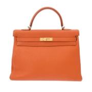 Pre-owned Leather handbags Hermès Vintage , Orange , Dames