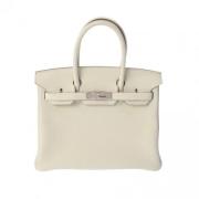 Pre-owned Leather handbags Hermès Vintage , Beige , Dames