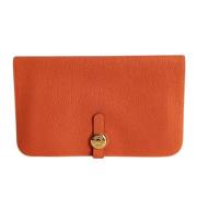 Pre-owned Leather clutches Hermès Vintage , Orange , Dames