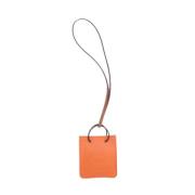 Pre-owned Leather key-holders Hermès Vintage , Orange , Dames