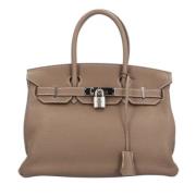 Pre-owned Leather handbags Hermès Vintage , Beige , Dames