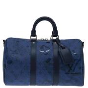 Pre-owned Canvas handbags Louis Vuitton Vintage , Blue , Dames