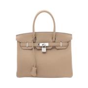 Pre-owned Leather handbags Hermès Vintage , Beige , Dames