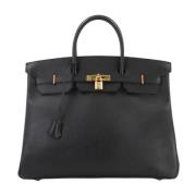 Pre-owned Leather handbags Hermès Vintage , Black , Dames