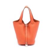 Pre-owned Leather handbags Hermès Vintage , Orange , Dames