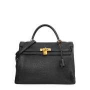 Pre-owned Leather handbags Hermès Vintage , Black , Dames