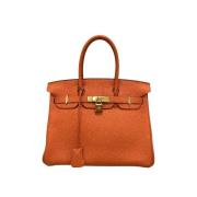 Pre-owned Leather handbags Hermès Vintage , Orange , Dames