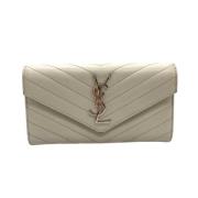 Pre-owned Leather wallets Yves Saint Laurent Vintage , Beige , Dames