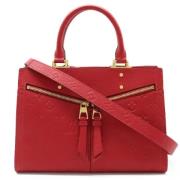 Pre-owned Leather handbags Louis Vuitton Vintage , Red , Dames