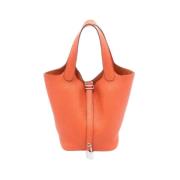 Pre-owned Leather handbags Hermès Vintage , Orange , Dames