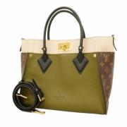 Pre-owned Fabric handbags Louis Vuitton Vintage , Brown , Dames