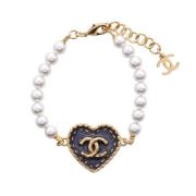 Pre-owned Metal bracelets Chanel Vintage , Yellow , Dames