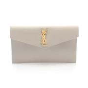 Pre-owned Leather clutches Yves Saint Laurent Vintage , Beige , Dames