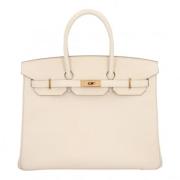 Pre-owned Leather handbags Hermès Vintage , Beige , Dames