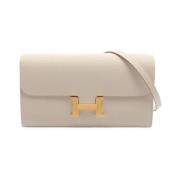 Pre-owned Leather clutches Hermès Vintage , Beige , Dames