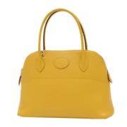 Pre-owned Leather handbags Hermès Vintage , Yellow , Dames