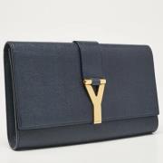 Pre-owned Leather clutches Yves Saint Laurent Vintage , Blue , Dames