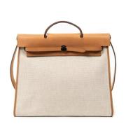 Pre-owned Canvas handbags Hermès Vintage , Beige , Dames