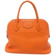 Pre-owned Leather handbags Hermès Vintage , Orange , Dames