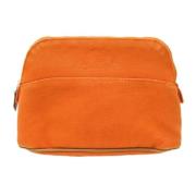 Pre-owned Canvas clutches Hermès Vintage , Orange , Dames